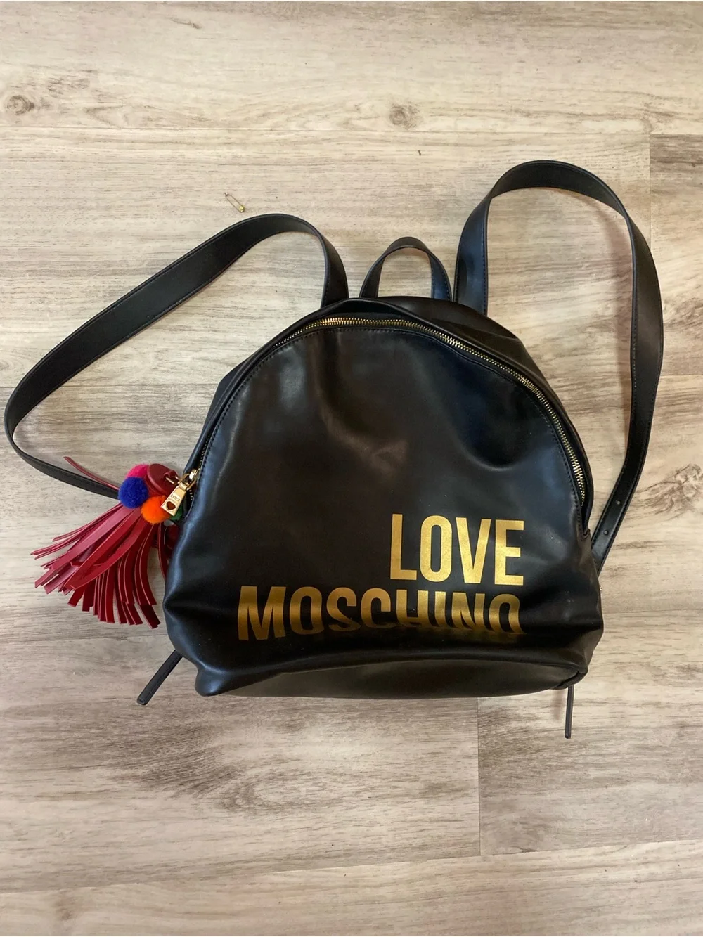 Love Moschino Black Backpack with Gold Logo and Red Tassel